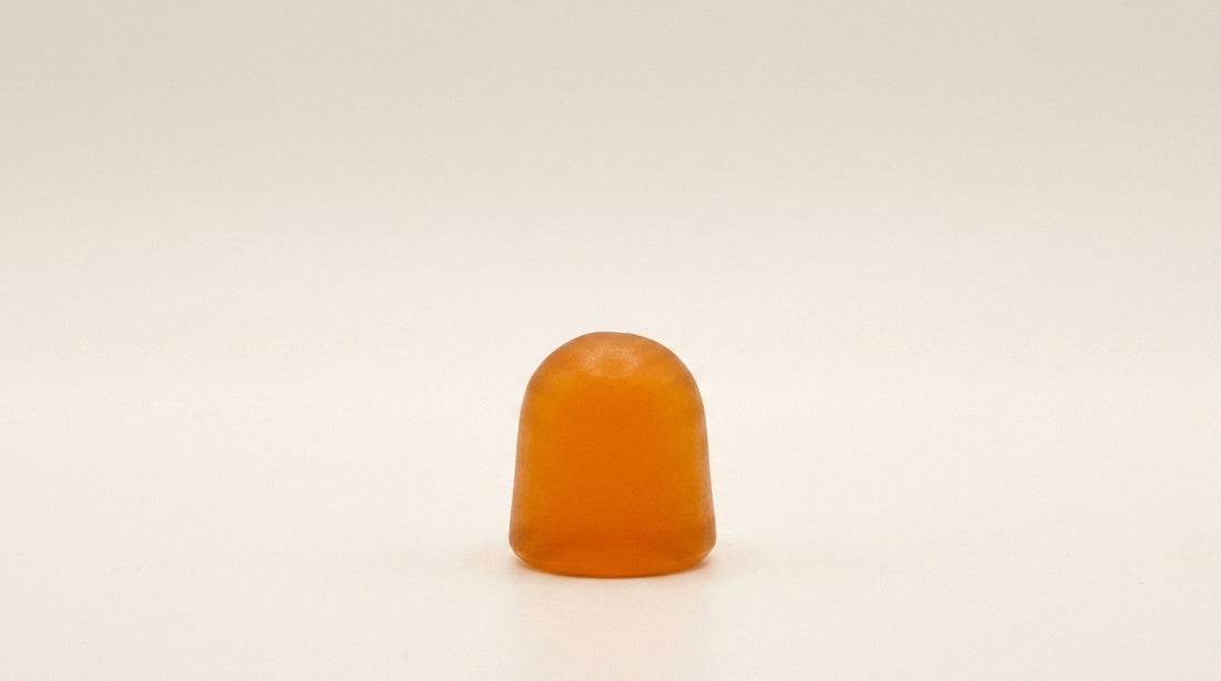 Amber On Call D3 gummy on a warm cream editorial background.