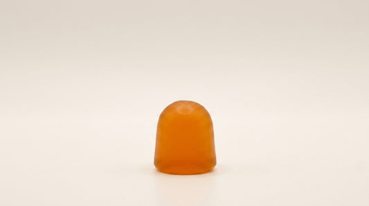 Amber On Call D3 gummy on a warm cream editorial background.